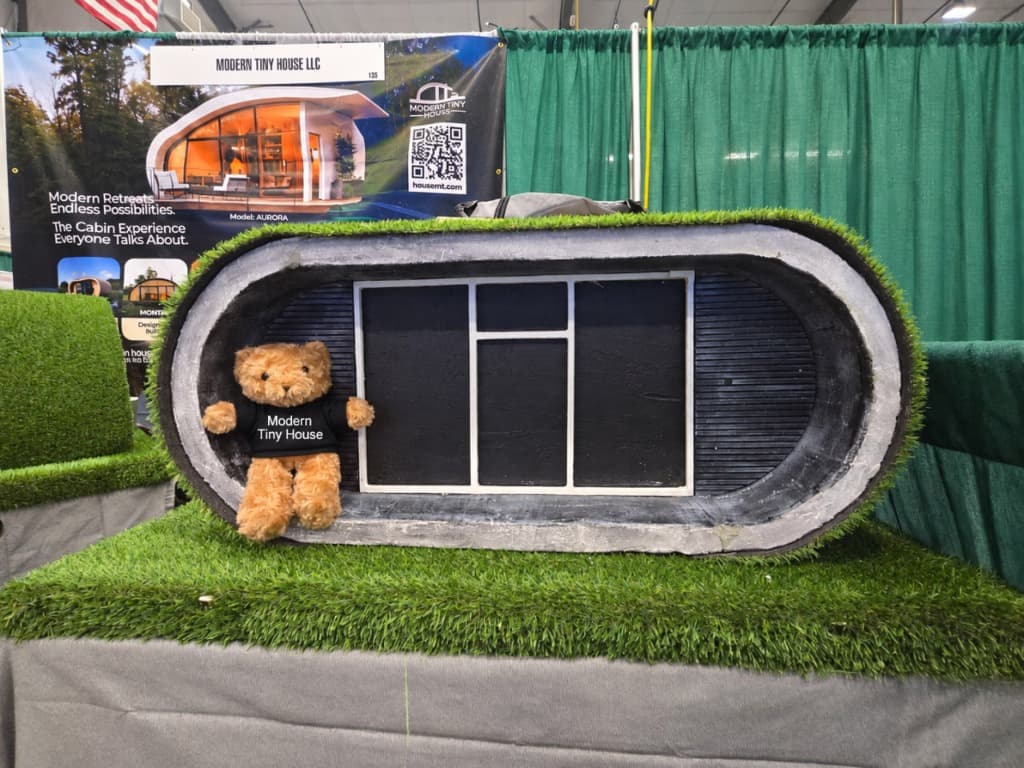 Modern Tiny House modular exhibition display with mascot